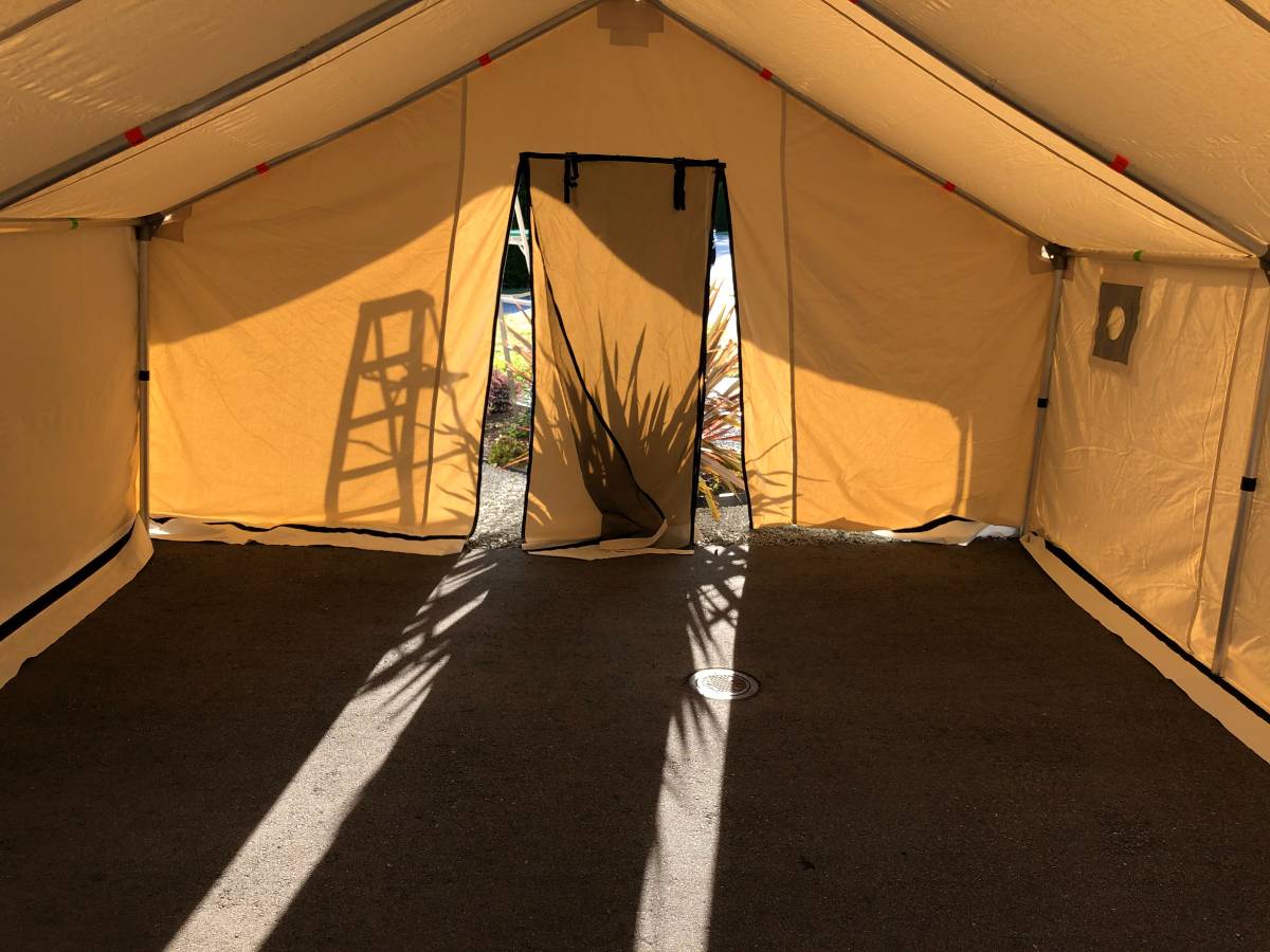 The inside of a tent with the door open