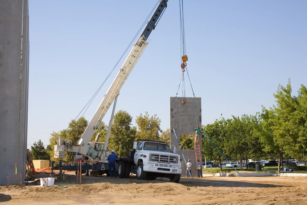 A Truck is Being Lifted by a Crane on a Construction Site — Smithys Crane Hire in Palm Cove, QLD