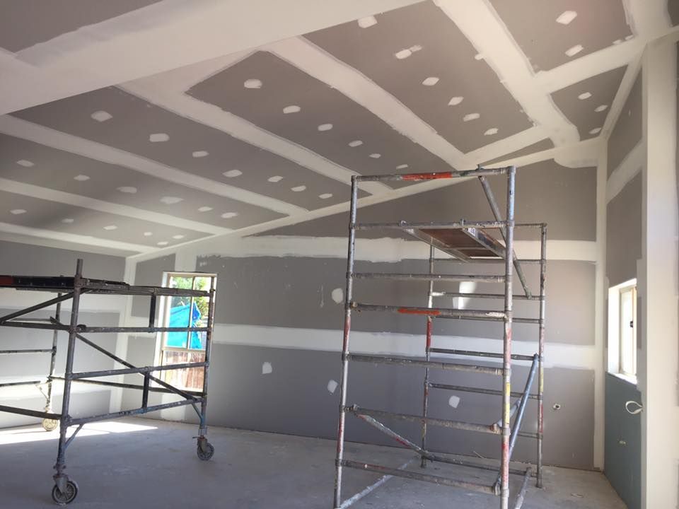 A room with a scaffolding and a ladder in it