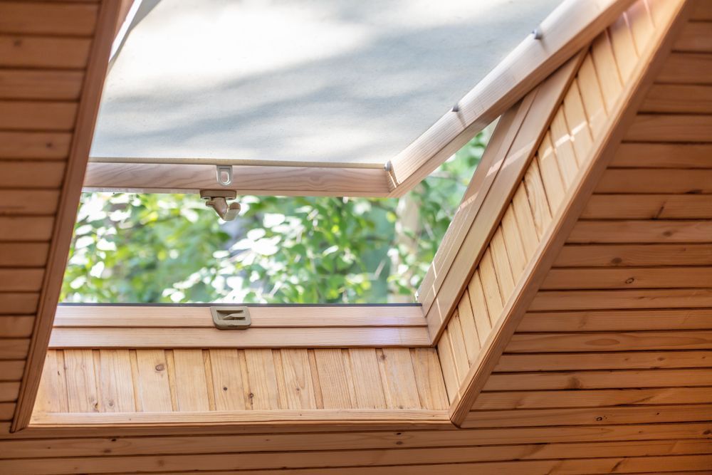 Open skylight bringing natural light and ventilation into a home
