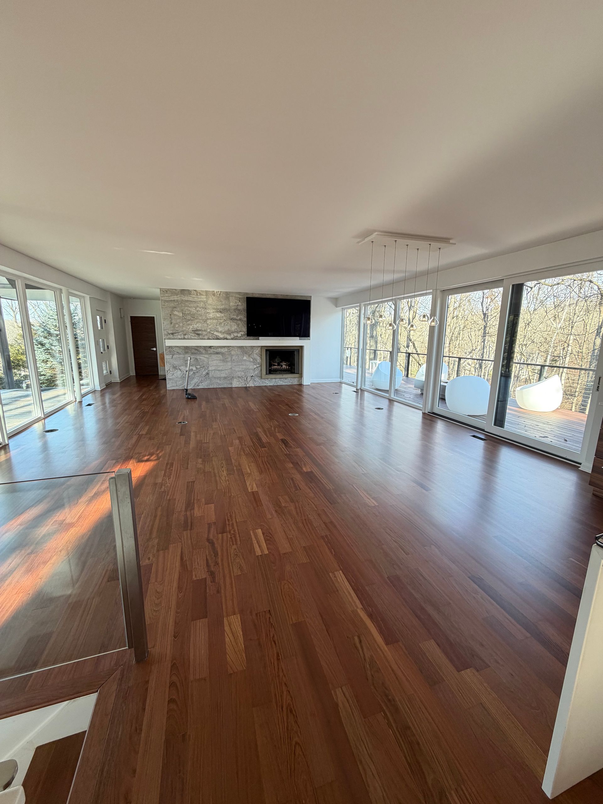 Refinished dark wood flooring in a family room