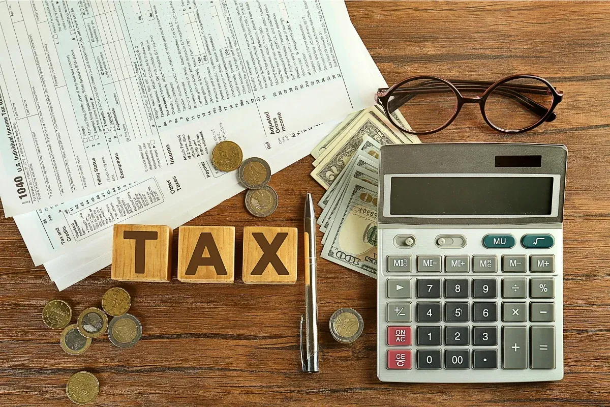 Retired couple reviewing financial paperwork — West Financial Group