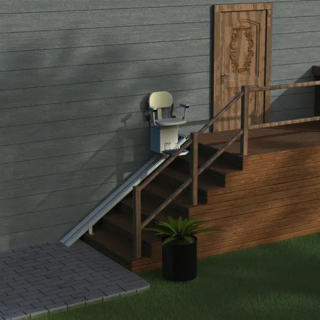Stair lift installed on outdoor stairs for accessibility. Beige chair and track on tan steps. Green foliage.