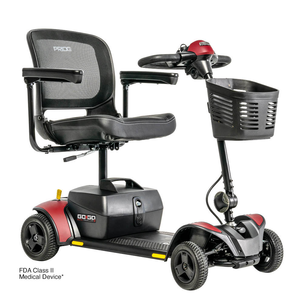 Red and black mobility scooter with a basket, seat, and armrests for an individual.