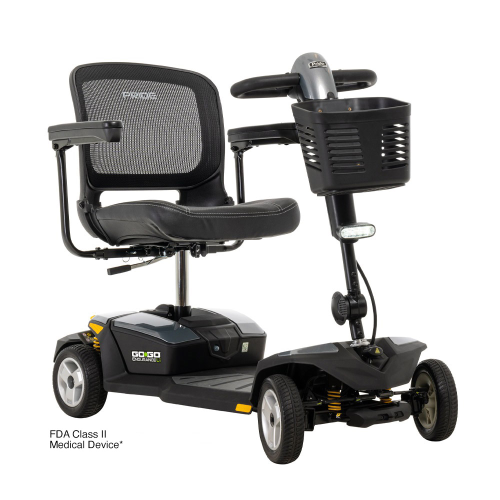 Black and grey mobility scooter with basket and mesh seat.
