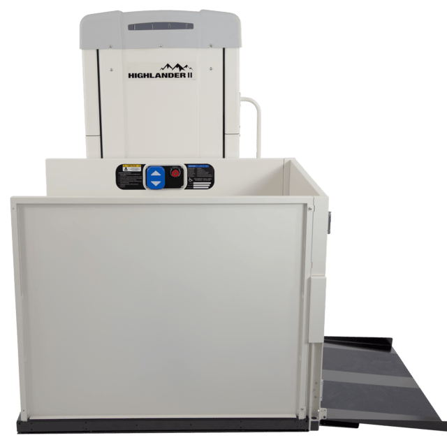 White Highlander II wheelchair lift with raised platform and ramp.