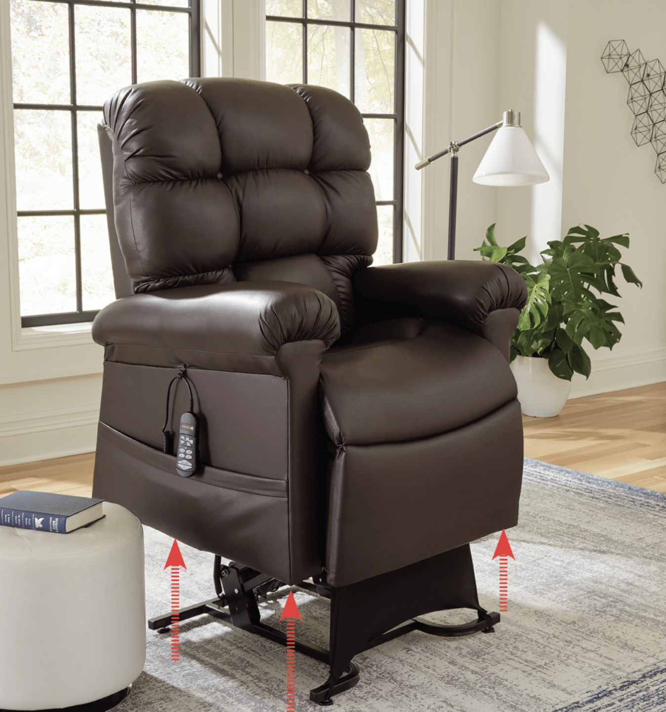 A brown leather recliner is sitting on a wooden table in a room.