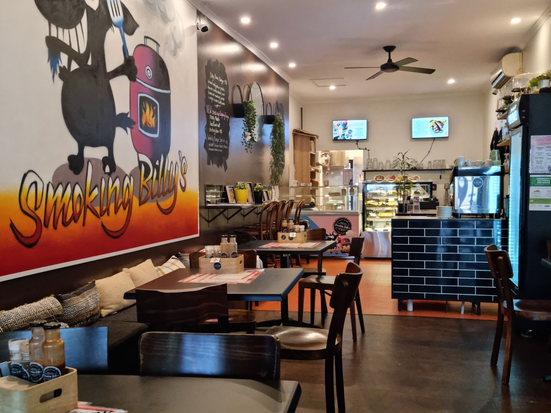Two People at a Table Displaying Dishware and Glassware at a Venue — Chefs2Go in Woodwark, QLD