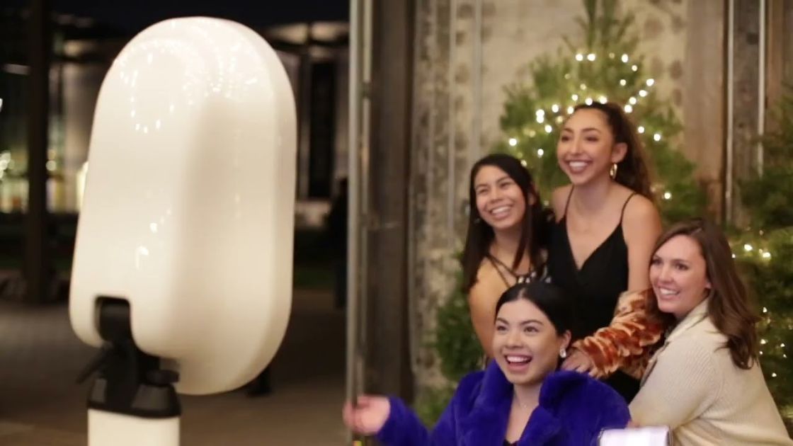 Guests enjoying a photo booth rental at a Denver event