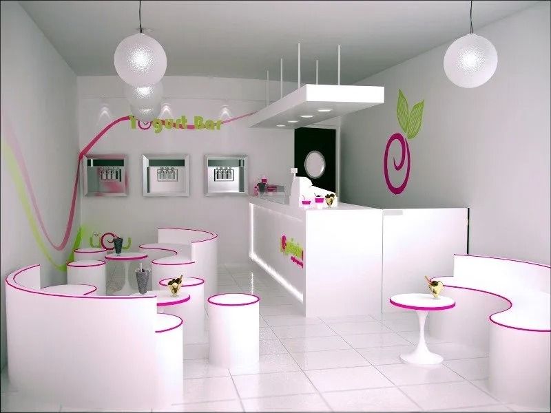 Interior de salón moderno en rosa y blanco con asientos curvos y una recepción central.