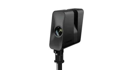 A black object is sitting on top of a pole on a white background.