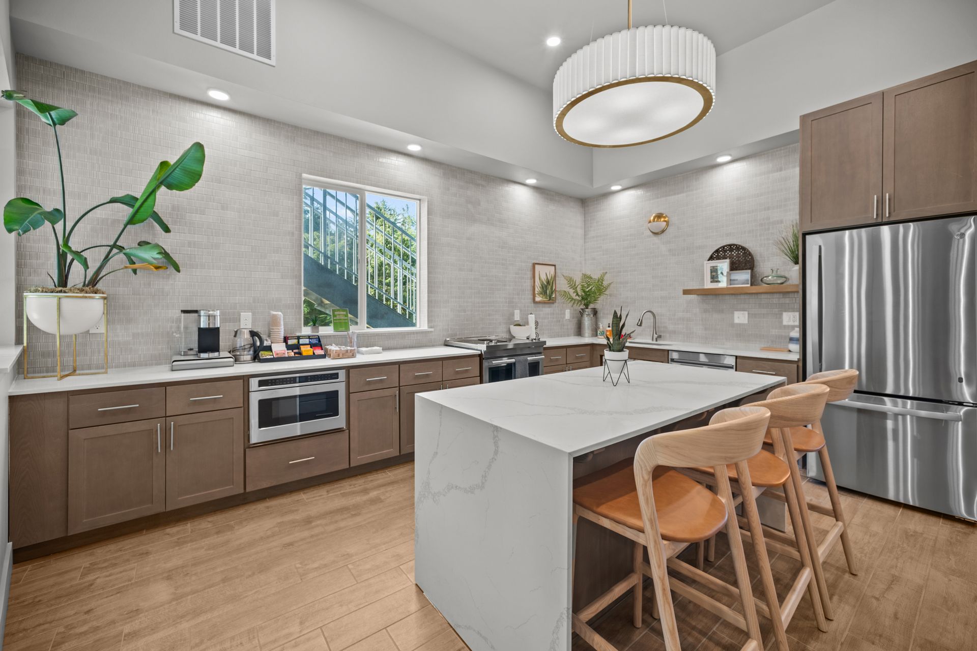 There is a large island in the middle of the kitchen.