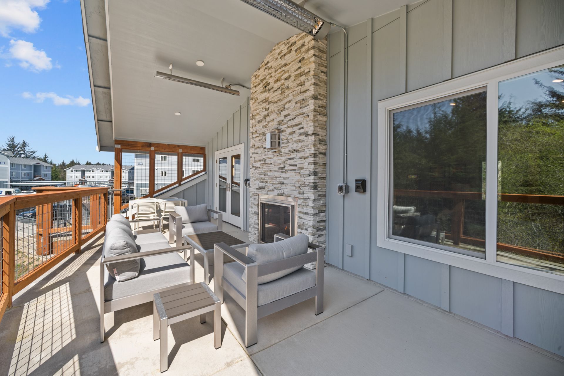 There is a fireplace on the balcony of a house.