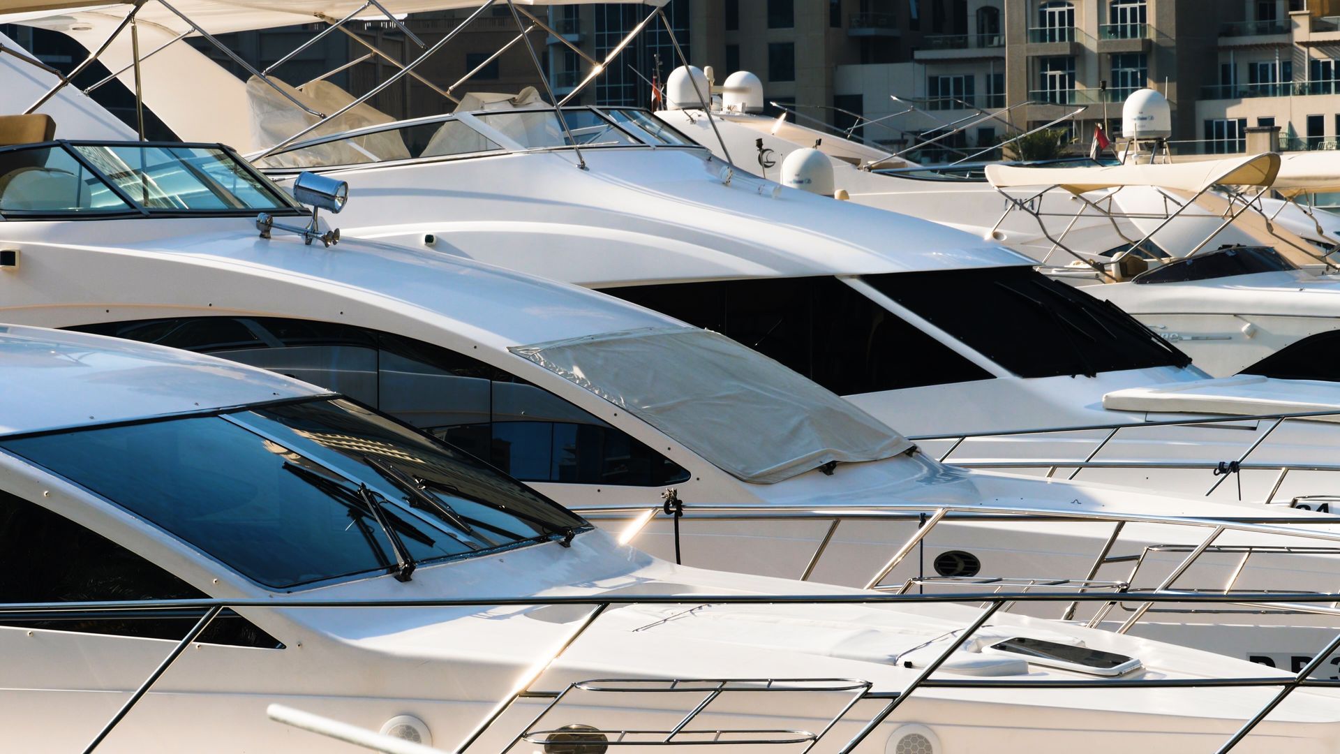 White yachts docked in a harbor