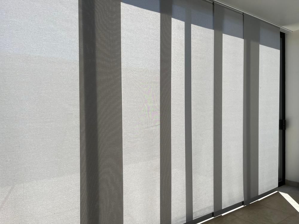 A Room With a Sliding Glass Door and Blinds on the Windows — Design 2000 Blinds & Awnings In San Remo, NSW