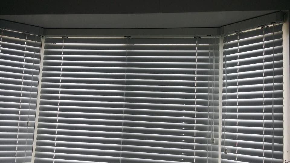 A Close Up of a Window With Blinds on It — Design 2000 Blinds & Awnings In San Remo, NSW