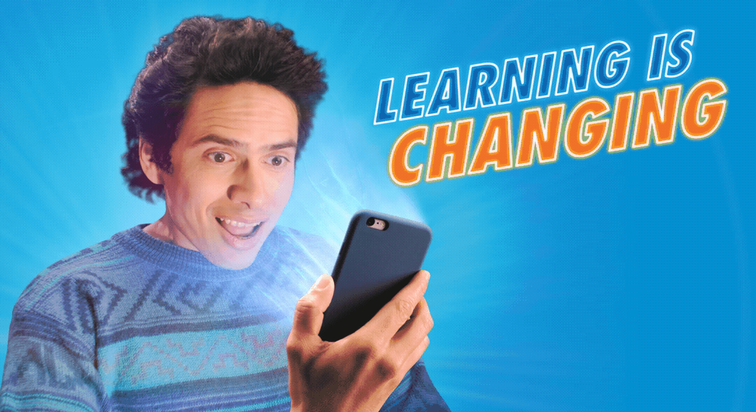 A man is looking at a cell phone with the words learning is changing behind him.