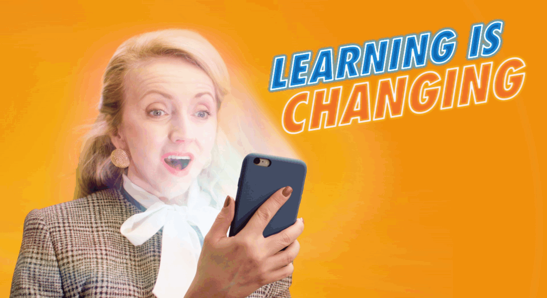 A woman is holding a cell phone in her hand.