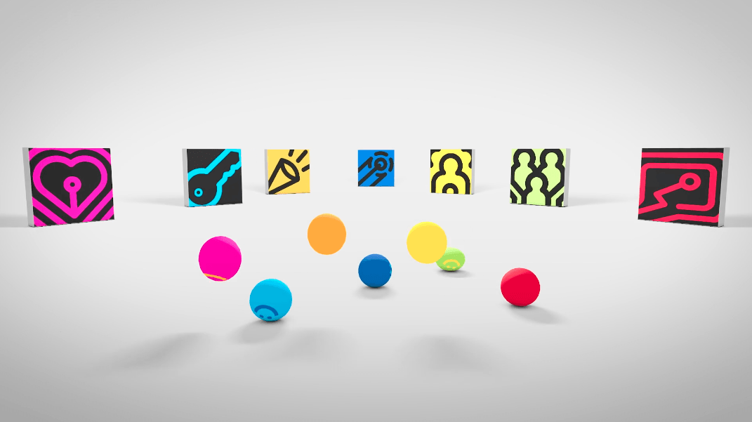 A bunch of colorful balls are sitting next to each other on a white surface.