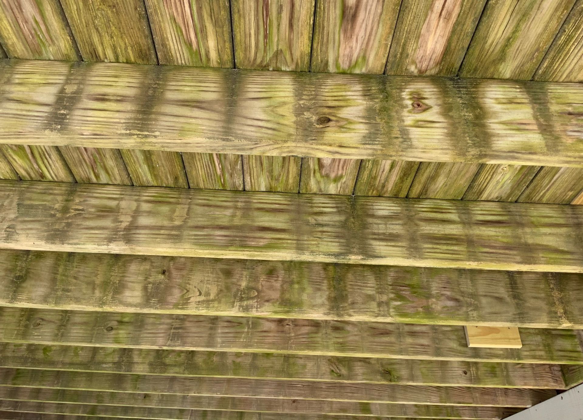Close-up of a woven straw or reed roof with horizontal layers and natural tan tones