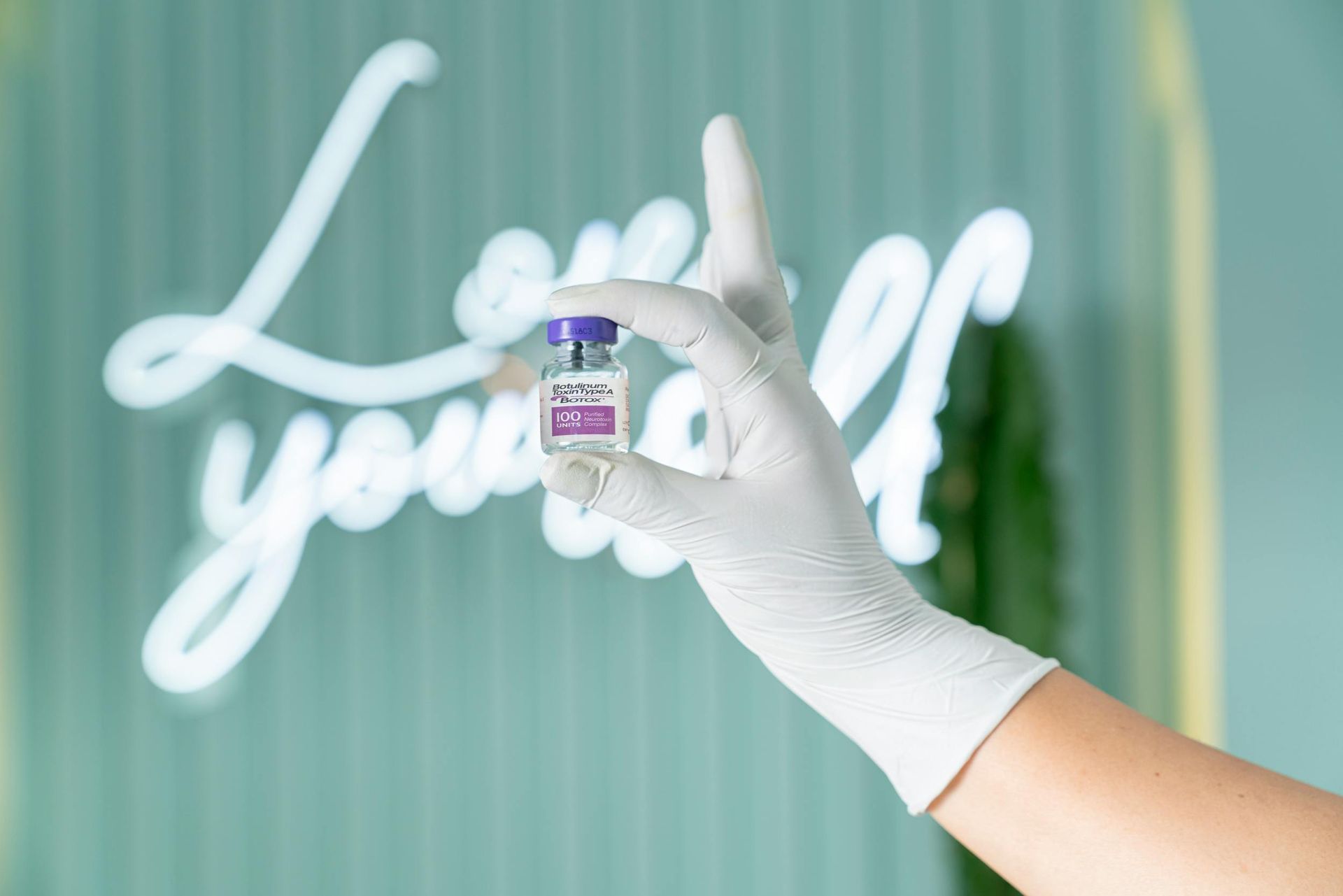 Wrinkle relaxer treatment vial held by a provider at VIOSA Aesthetics MD