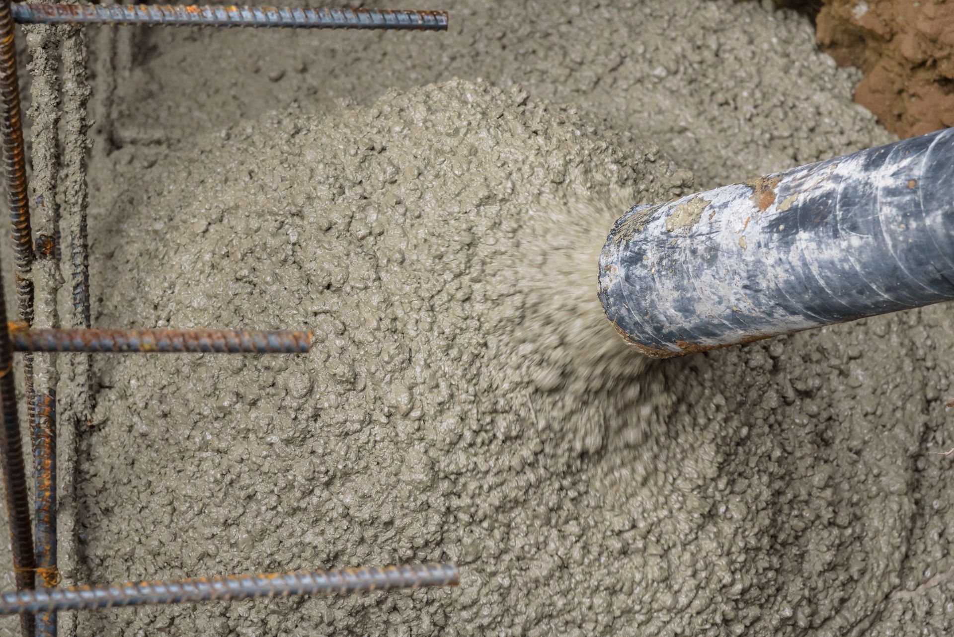 Hole being filled with concrete