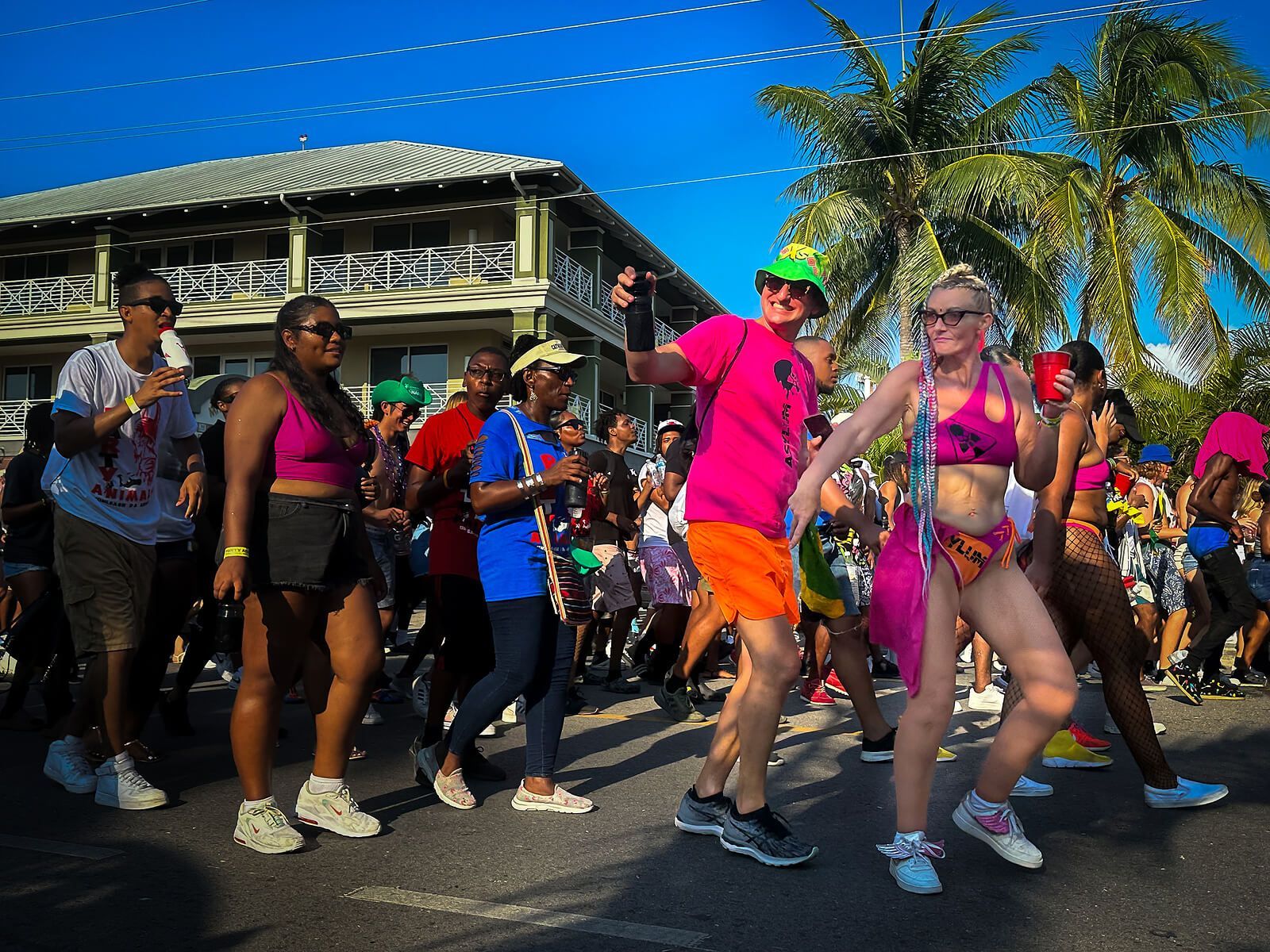 A couple dances in the street during Carnival. Get back in the dance with the help of a Couples Retreat in Florida. Couples Retreats are open to anyone in the United States. Reach out for more info.