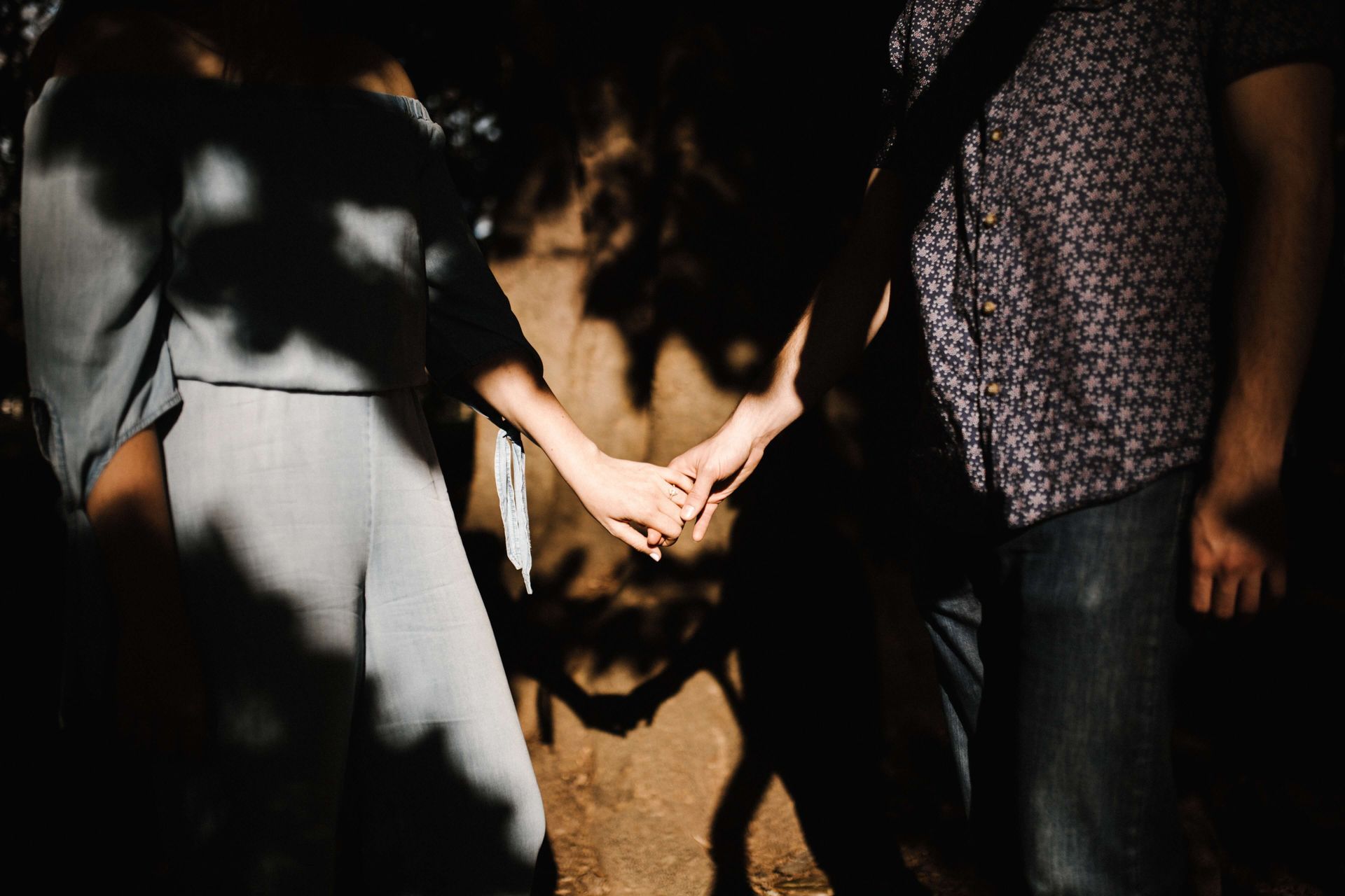 A couple holds hands with new found commitment to each other after attending a Couples Retreat in Florida. Hold Me Tight® workshops are available in Florida, Georgia, North Carolina, Virginia and beyond! Let our couples retreat bolster your couples therapy.