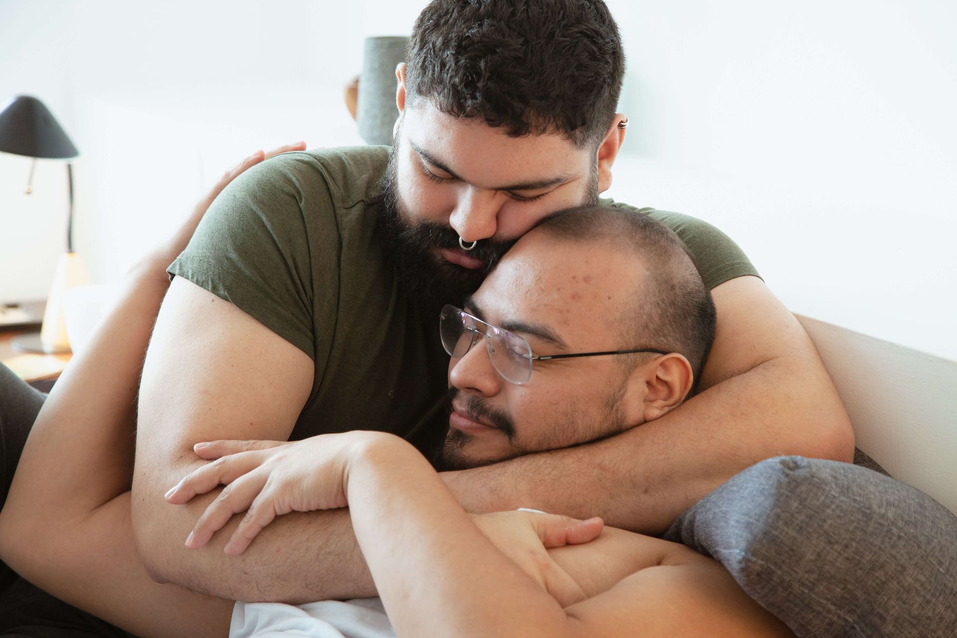 A gay couple embraces with new found connection after attending a Hole Me Tight® Couples Retreat in Orlando, FL. Couples Retreats are offered to anyone Nationwide.