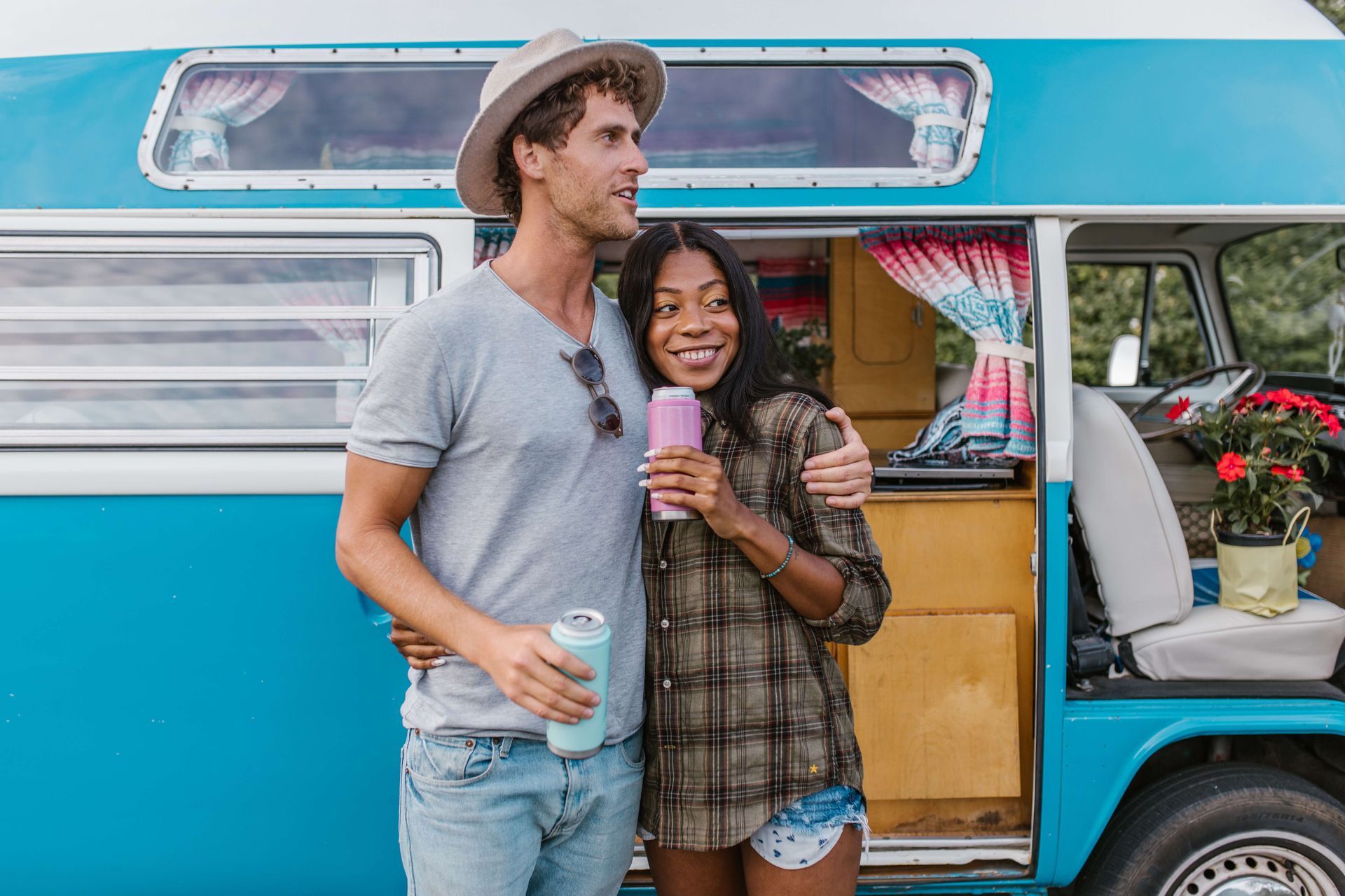 A couple stands together in front of their van smiling and embracing after attending a Couples Retreat in Orlando, FL. Couples Retreats are available to people throughout the United States. Learn more about Couples Retreats in Florida here.