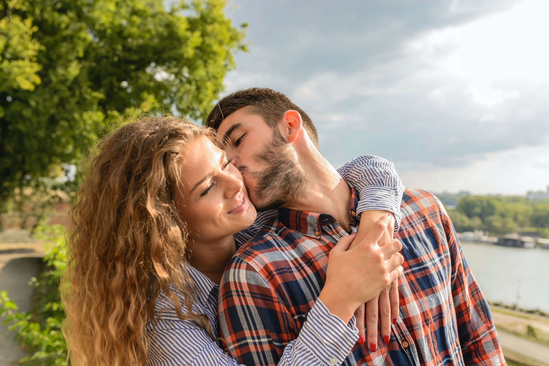 A happy couple embraces and smiles after completing a Hold Me Tight® Couples Retreat in Orlando, FL. Couples Retreats are available to couples throughout the United States.