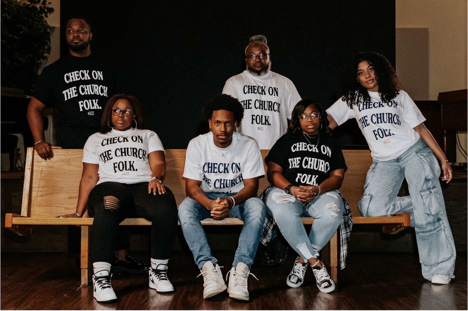 Group of six people in t-shirts that say