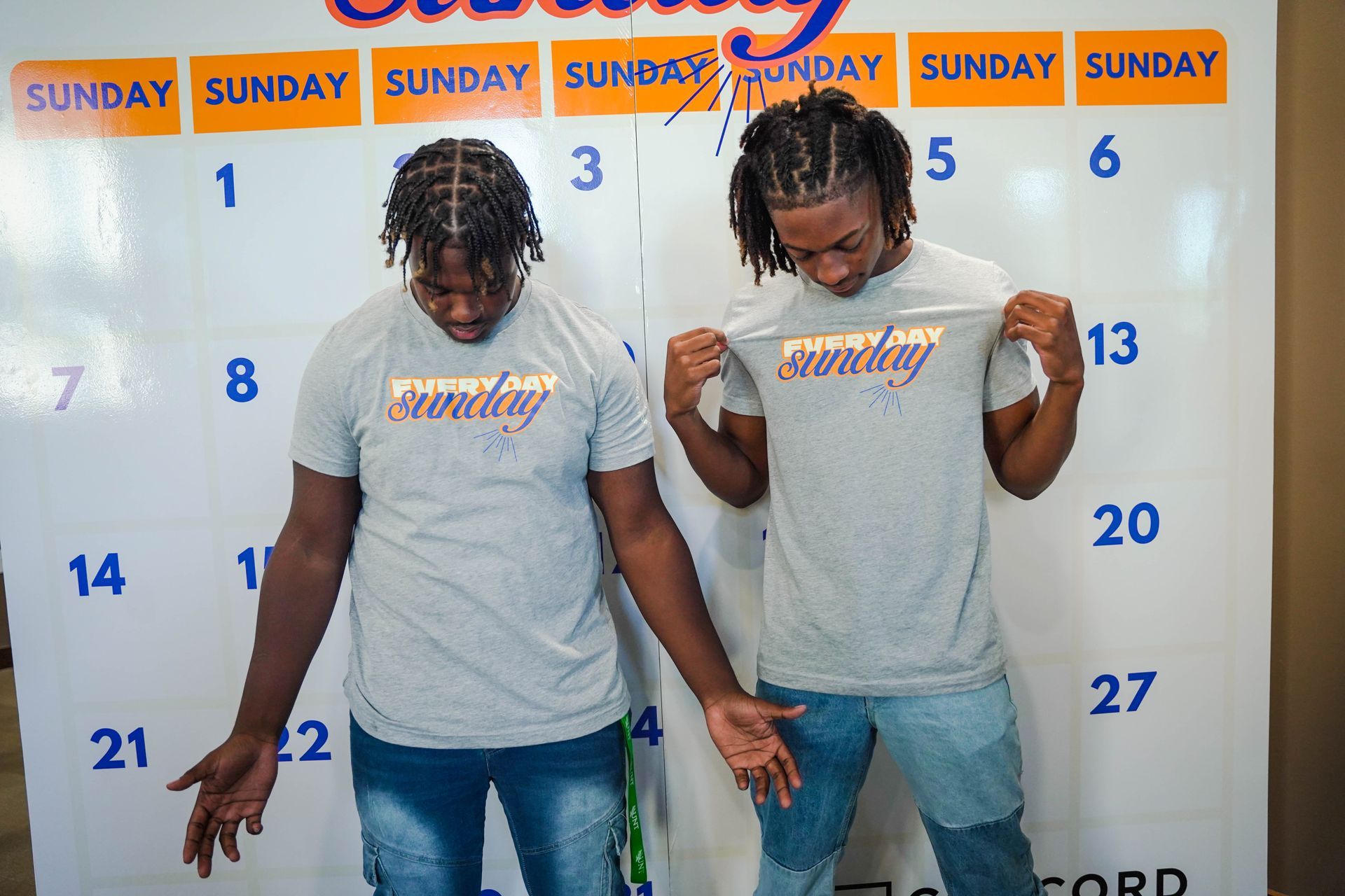 Two men in gray shirts with 