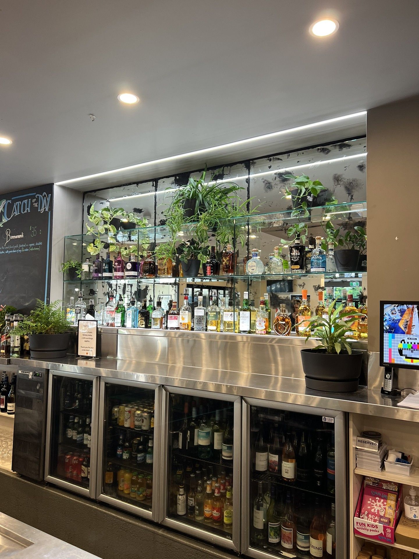 The inside of a Bar with Lights by the mirror  — Gealy's Air-Conditioning, Refrigeration & Electrical in Noosaville, QLD