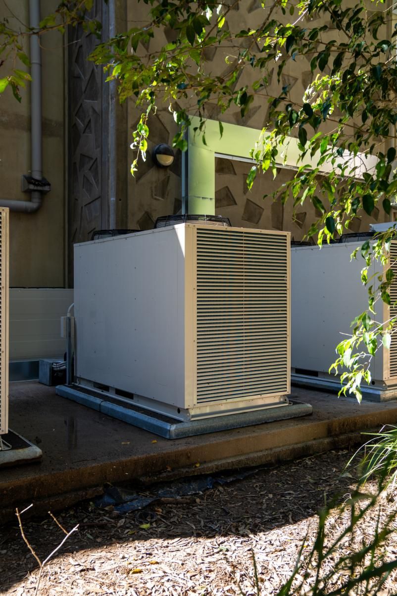 Outdoor Air Conditioning Units on a Concrete Pad — Gealy's Air-Conditioning, Refrigeration & Electrical in Noosaville, QLD
