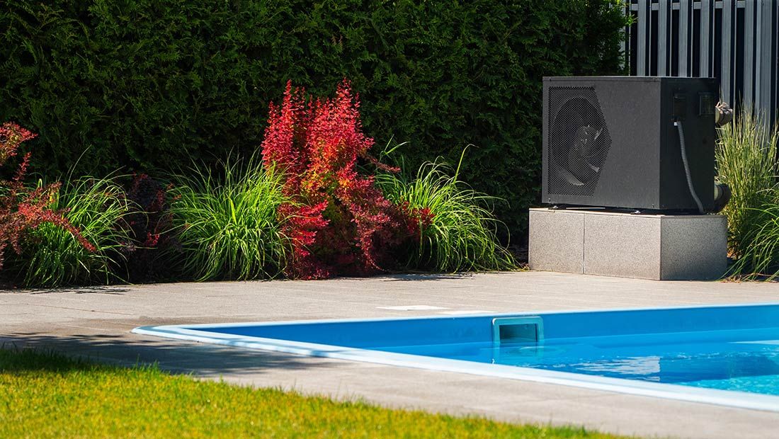 A Swimming Pool With a Heater on the Side of It — Gealy's Air-Conditioning, Refrigeration & Electrical in Gympie, QLD