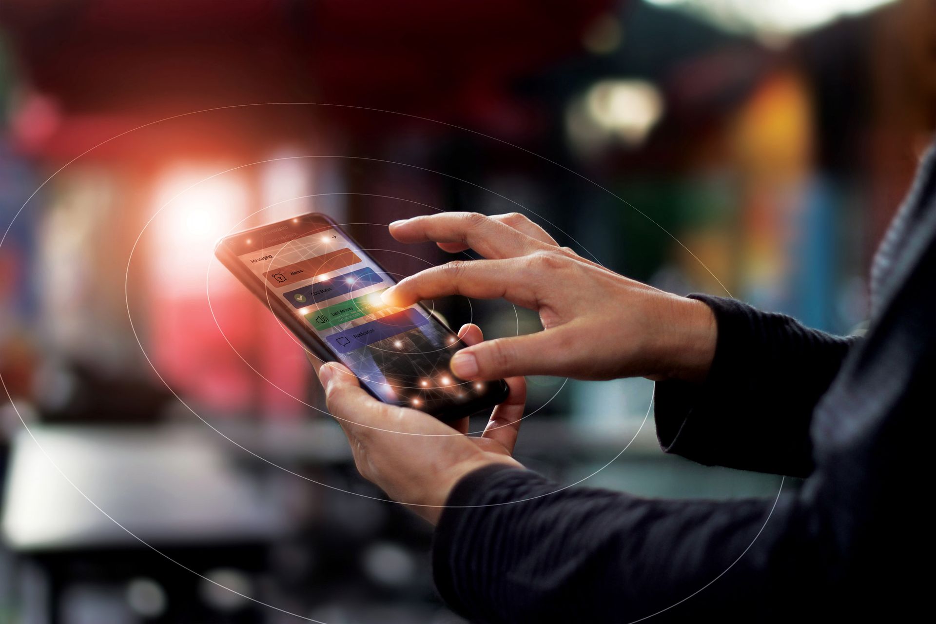 A person is using a smart phone in a restaurant.