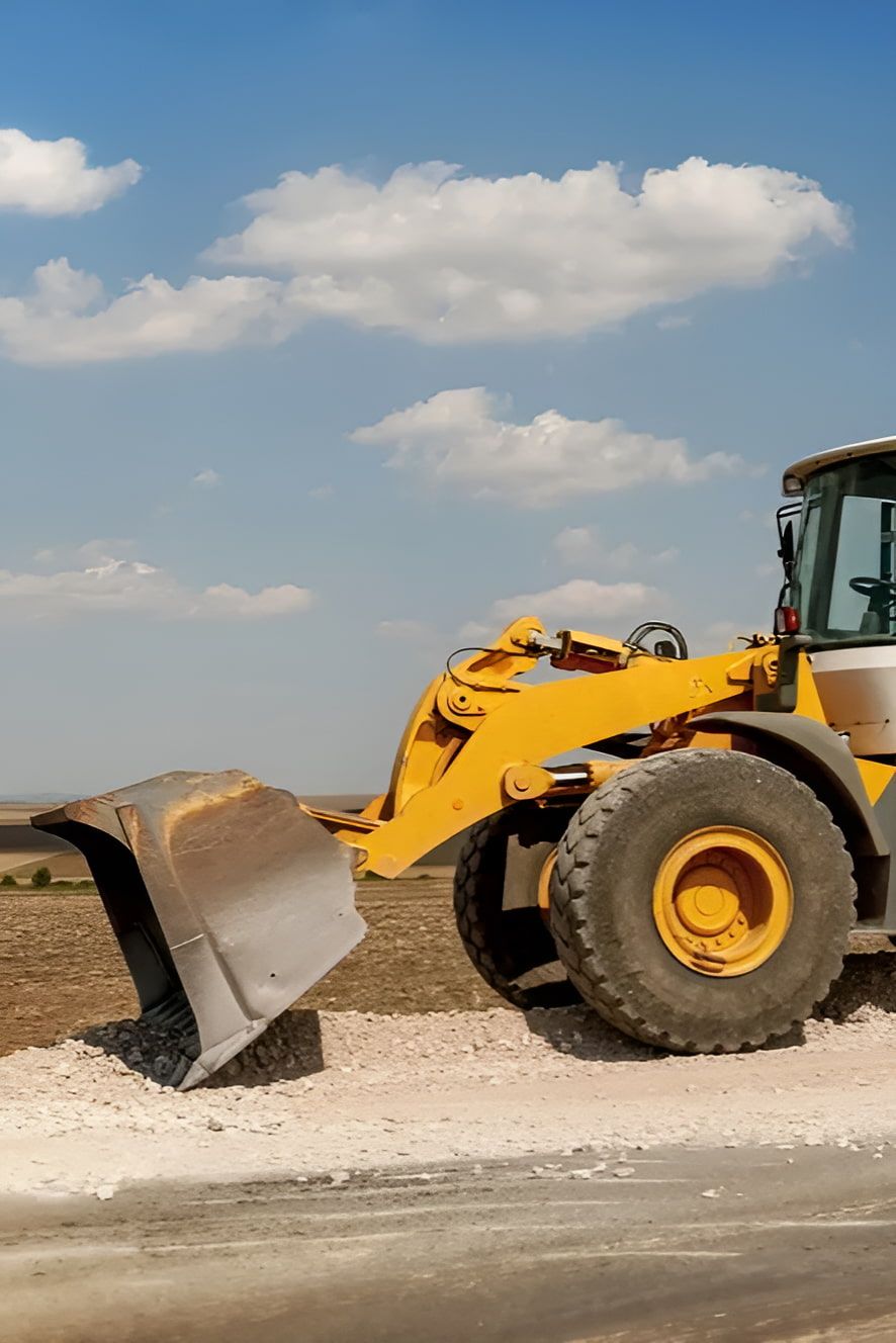 A Yellow Bulldozer is Sitting on the Side of a Road —  A & B Mullins Excavations Pty Ltd in Childers, QLD