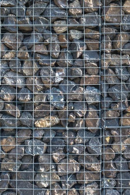 A Pile of Rocks Behind a Wire Fence —  A & B Mullins Excavations Pty Ltd in Bungadoo, QLD