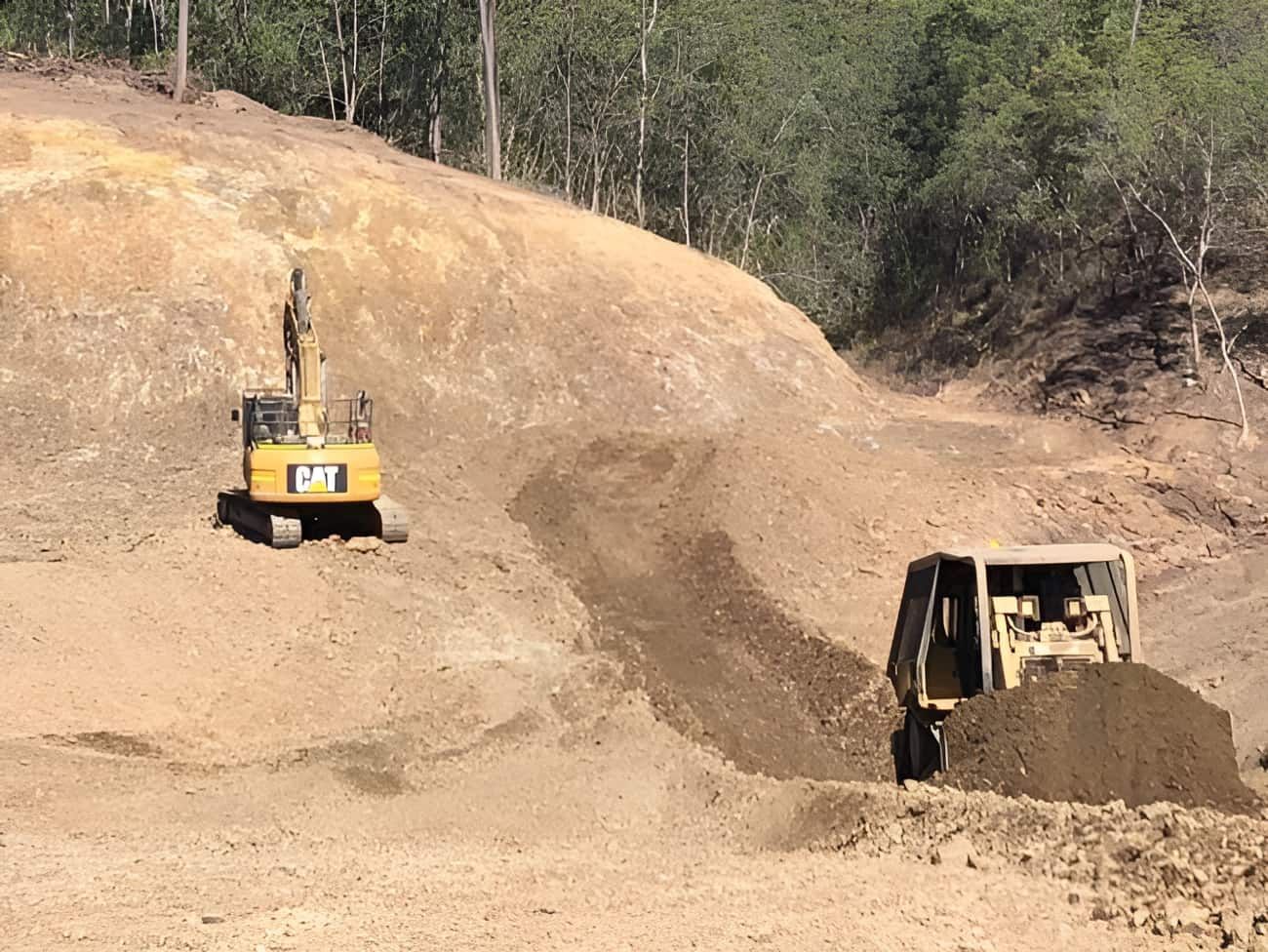 A Bulldozer and an Excavator Are Working on a Dirt Field —  A & B Mullins Excavations Pty Ltd in South Kolan, QLD