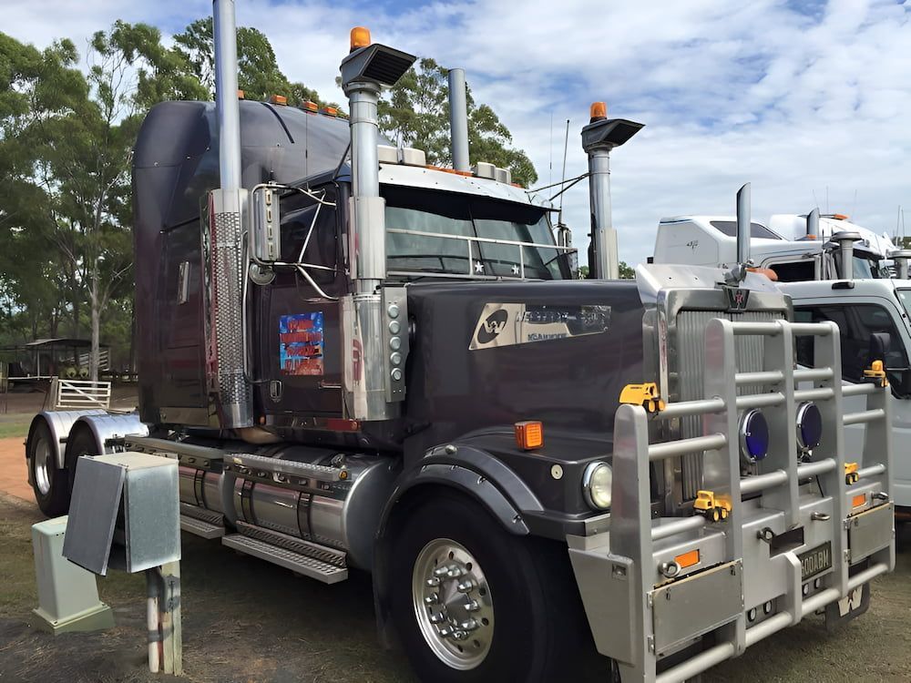 A Large Semi Truck is Parked on the Side of the Road —  A & B Mullins Excavations Pty Ltd in Childers, QLD