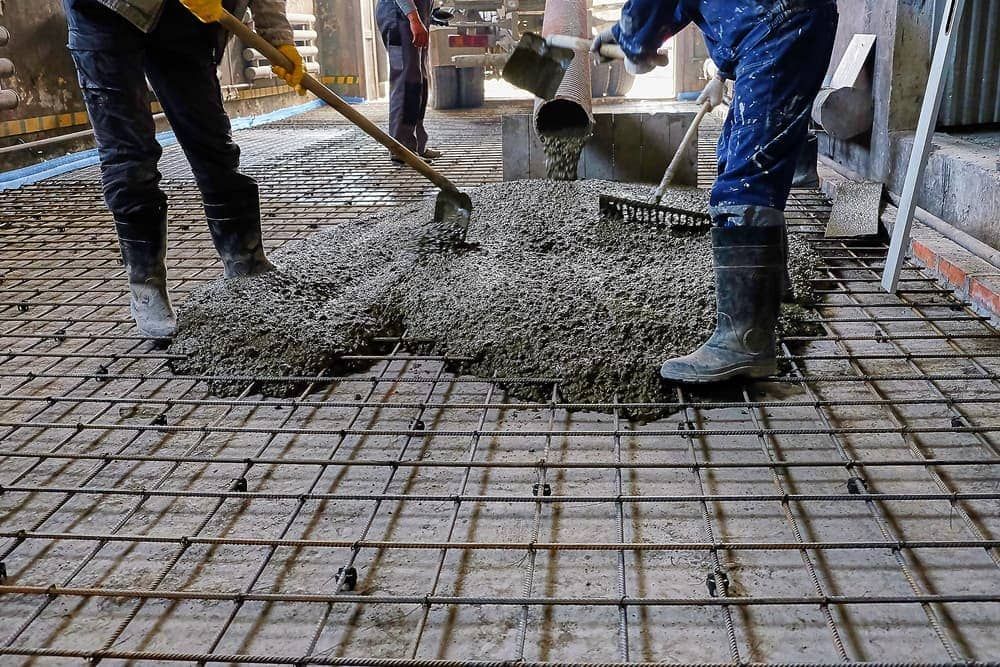A Construction Workers Are Pouring Concrete on a Floor —  A & B Mullins Excavations Pty Ltd in Bungadoo, QLD