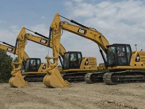 Three Cat Excavators Are Parked in a Dirt Field — A & B Mullins Excavations Pty Ltd in Bundaberg, QLD