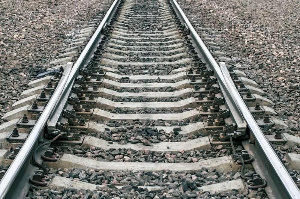 A Close Up of a Train Track With a Lot of Rocks on It — A & B Mullins Excavations Pty Ltd in Bundaberg, QLD
