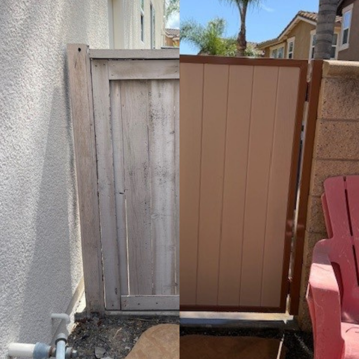 Closed brown and white wooden gate beside a stucco wall in a narrow outdoor passage.