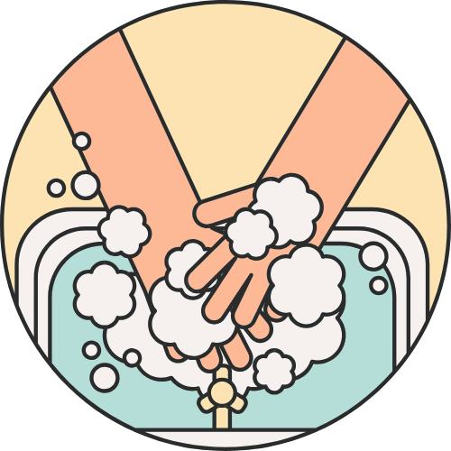 Hands washing with soap in a sink, bubbles around them.