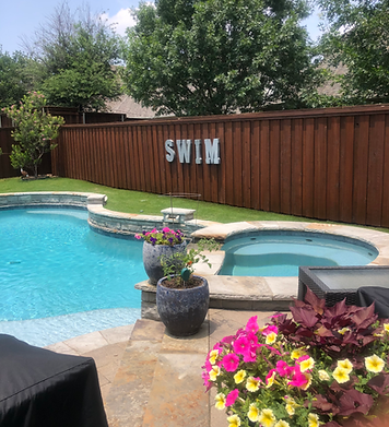 A swimming pool with a sign that says swim on it.