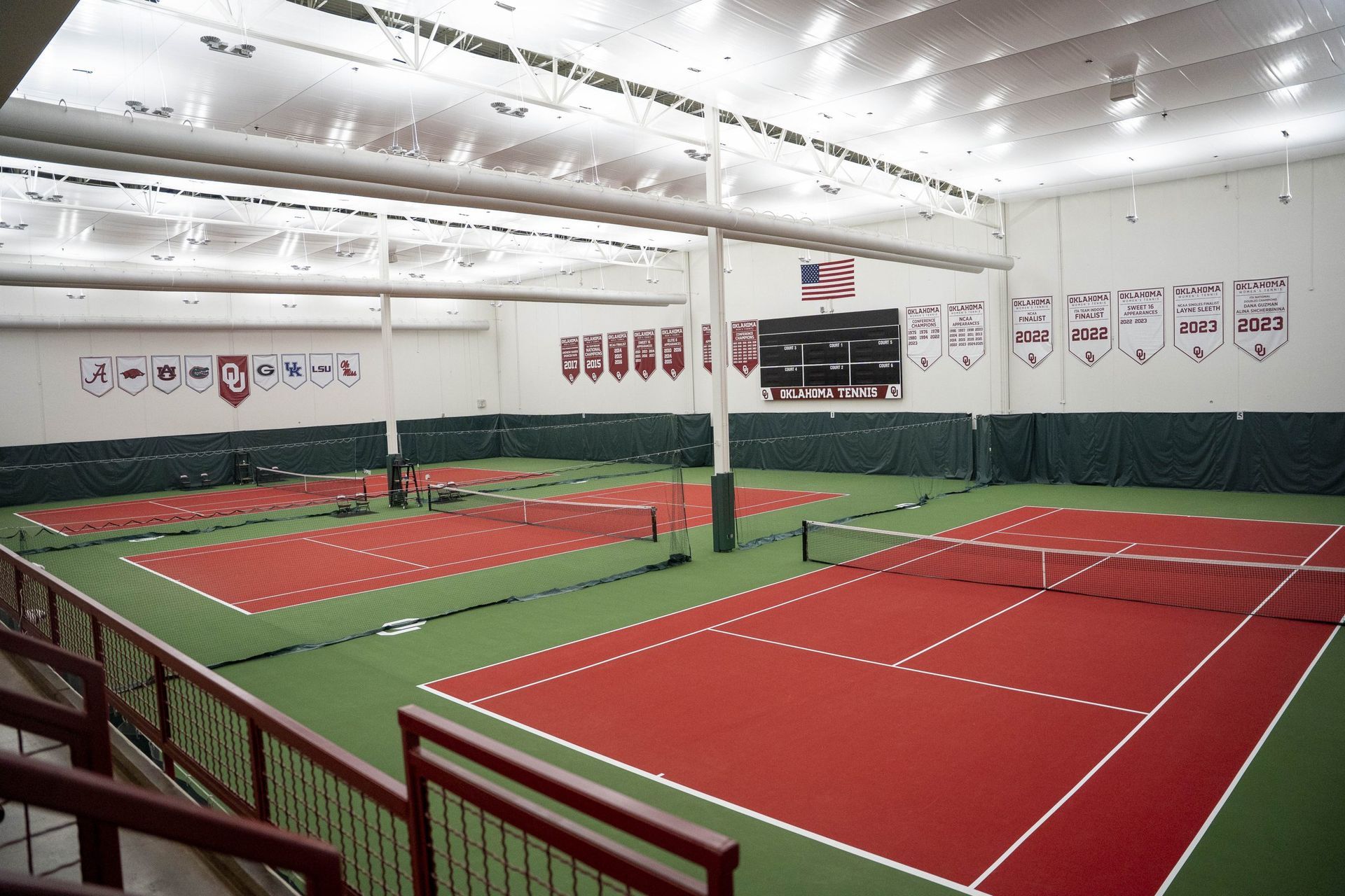 Indoor tennis courts with Laykold red and green surface