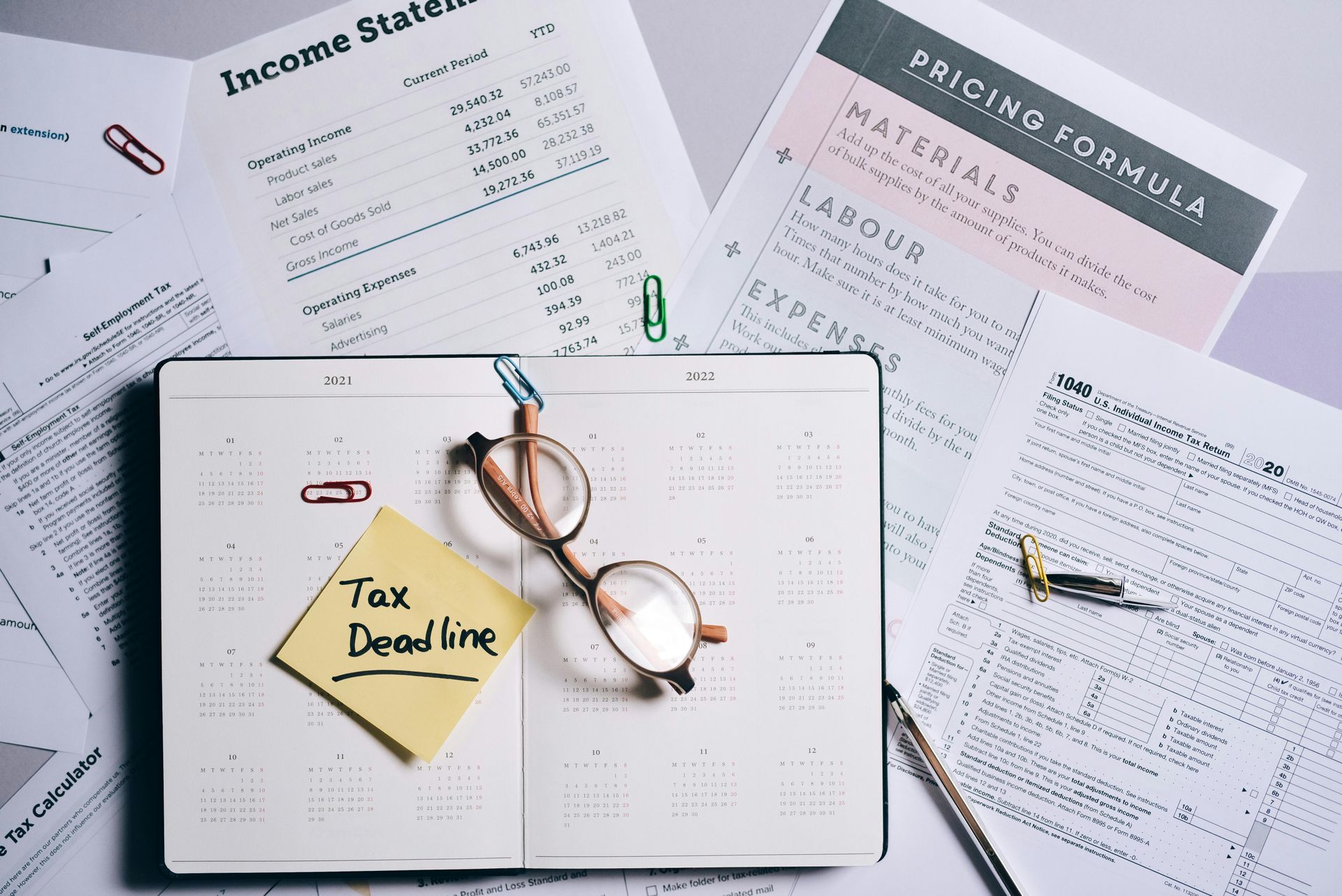 A calendar with a sticky note on it that says tax due date