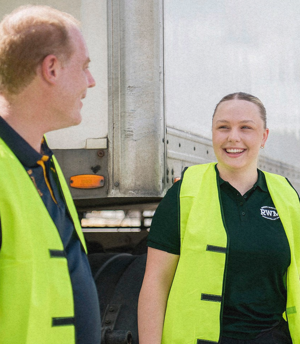 A man with a beard is sitting in the driver 's seat of a truck